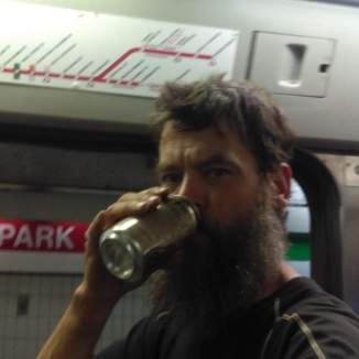 City Slicka Patrick O'Meara drinking on a red line train in Boston